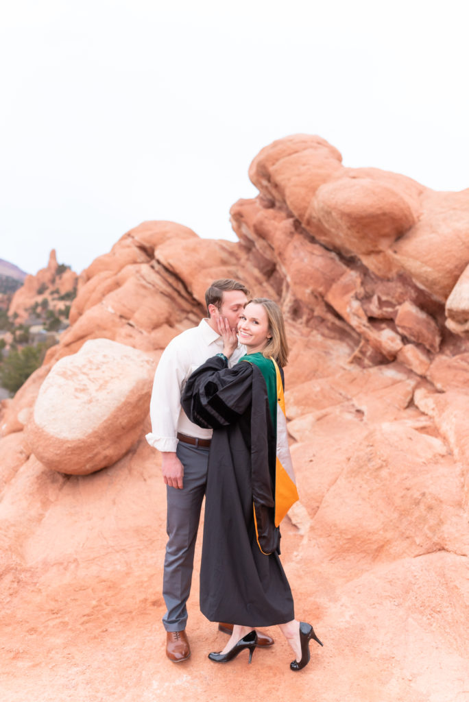 Couple graduation portrait photo at garden of the gods park within Colorado Springs 