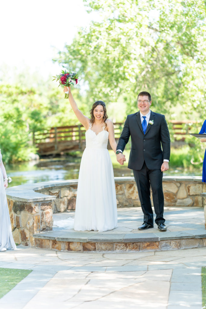 Photo of ceremony of a summer wedding at Hudson Gardens and Event Center Colorado Wedding Venue. 