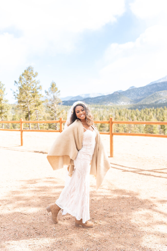 Portrait of bride smiling at pikes peak mountain in Colorado Springs