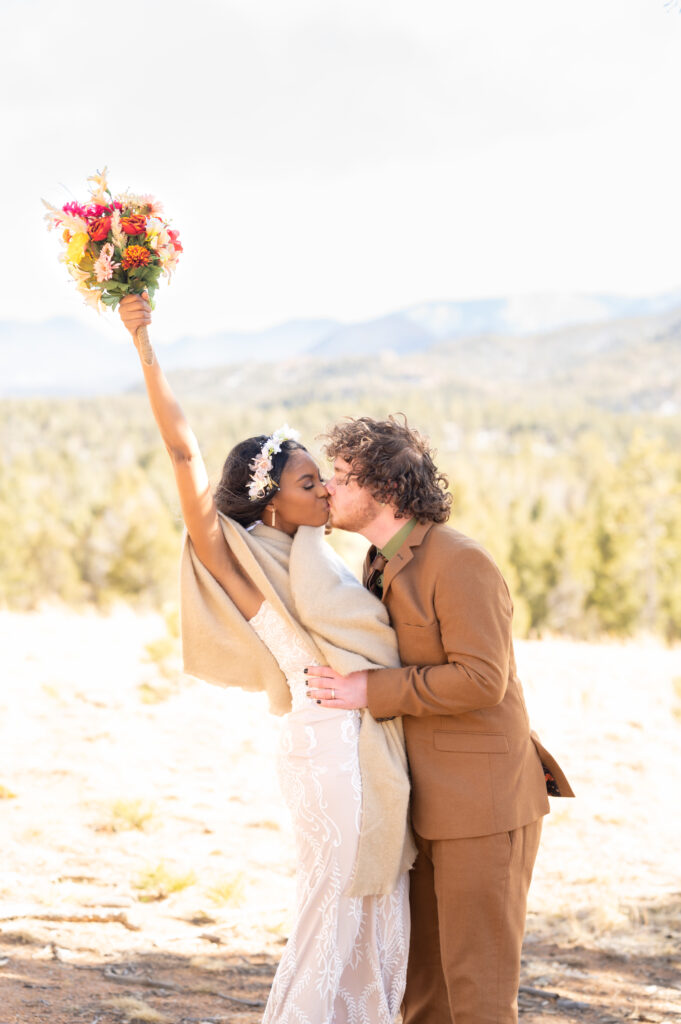 Bride and groom kissing to celebrate their elopement in Colorado Springs 