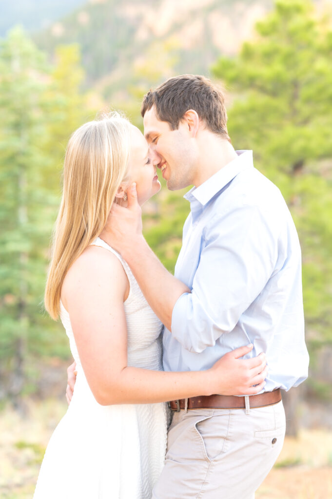 Couple going in for a passionate kiss during their Colorado Engagement Photoshoot