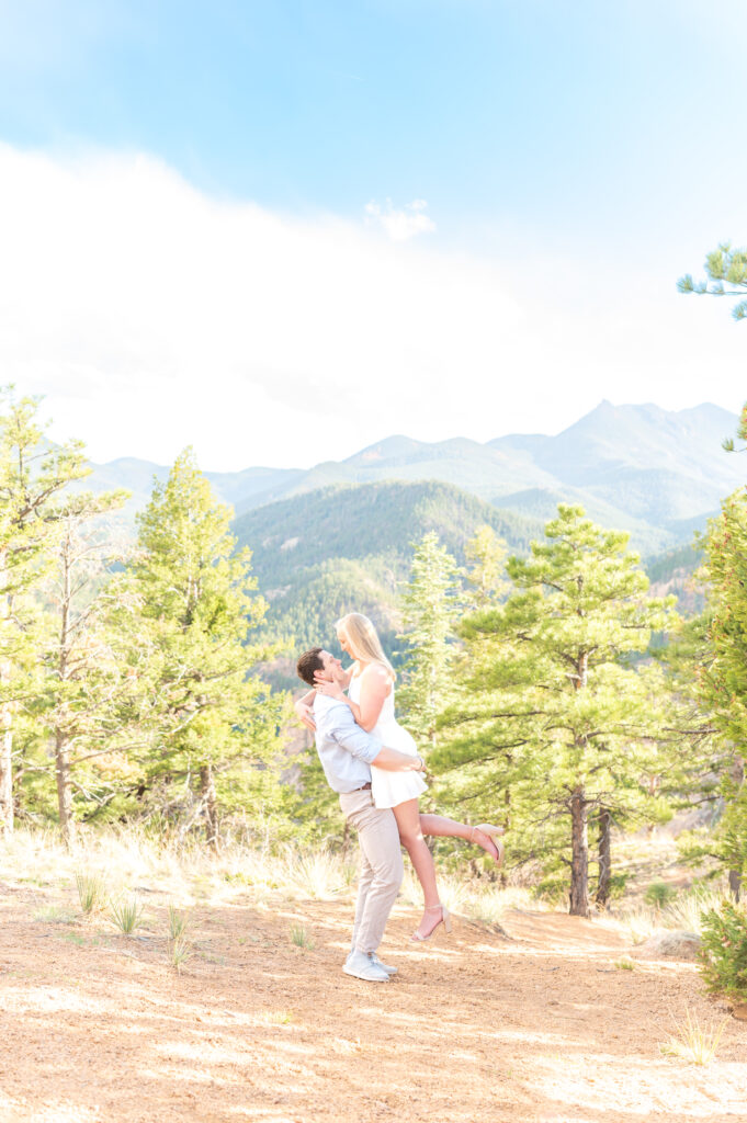 Landscape photo of a couple in love soaking in the mountain views