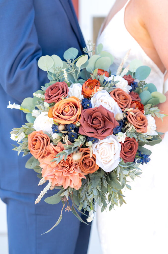 Are wedding photos worth the investment? Closeup of bride's bouquet, filled with autumn colored flowers