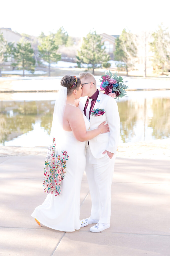 Colorado Elopement Photographer capturing brides leaning in for a passionate kiss during their portraits on their elopement day in Colorado