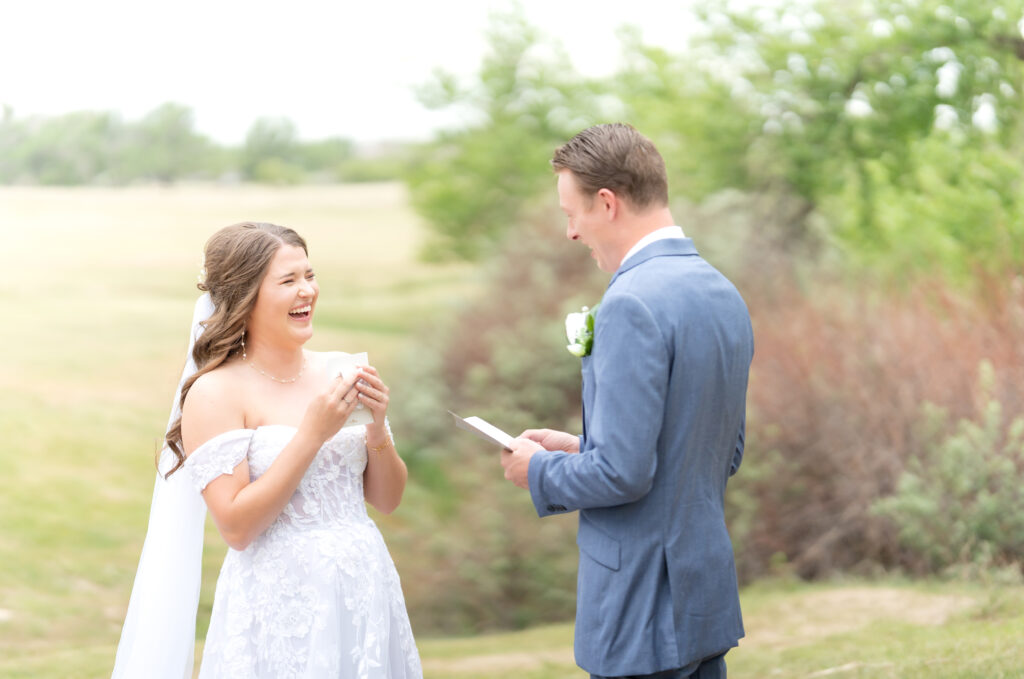 Bride and Groom laughing together while sharing their private vows 