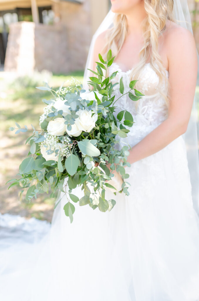 close up photo of the bride holding her wedding day floral bouquet