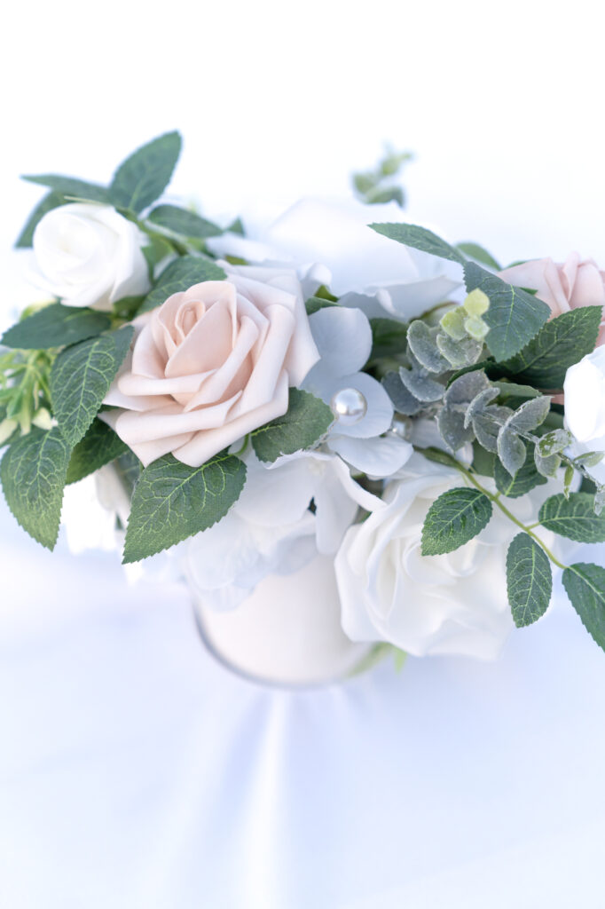 Detail photo of floral bouquet sitting on a white table 