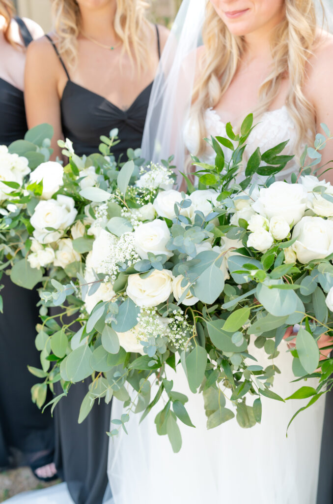 Photo of floral greenery of the brides wedding bouquet and bridesmaids bouquets 