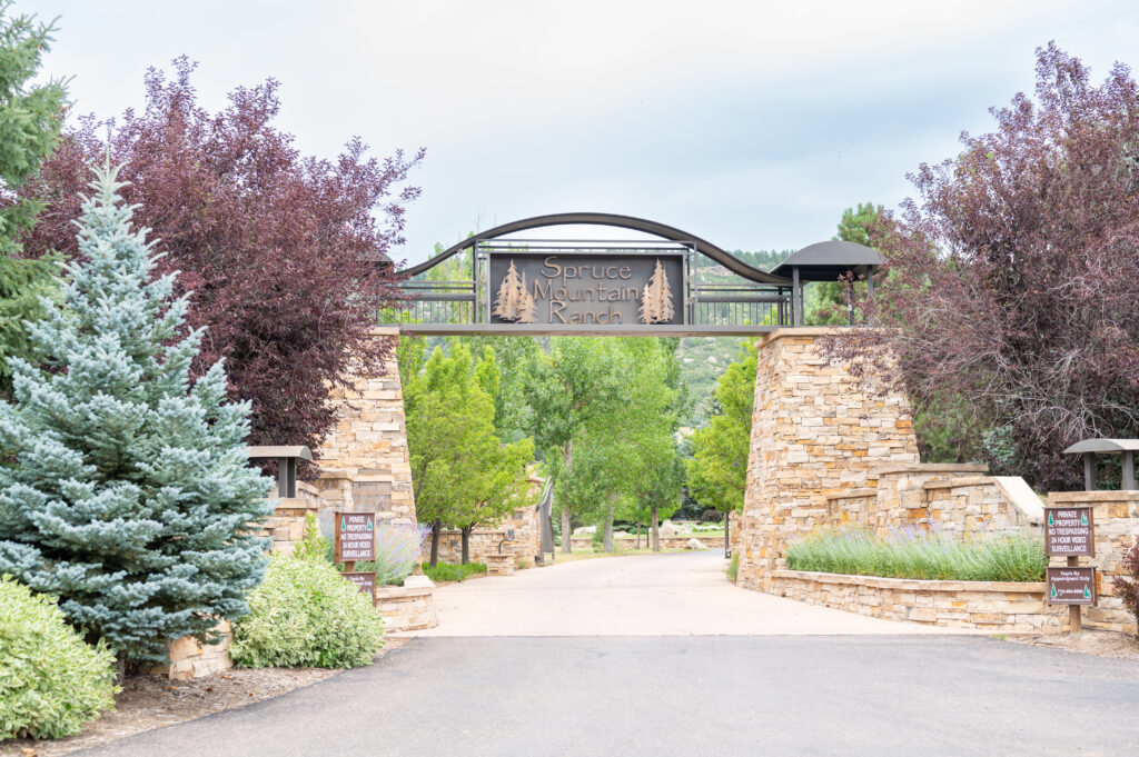 Entrance to Spruce Mountain Ranch, a tree-lined wedding venue in Larkspur, Colorado