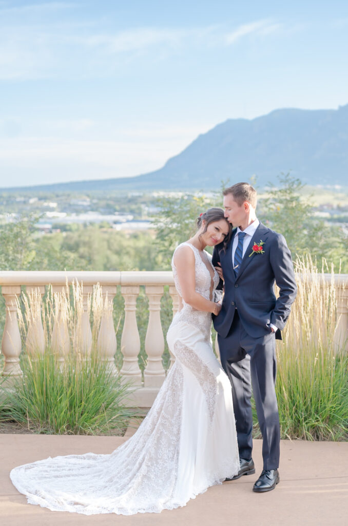 Couple holding hands with mountain views at The Pinery At The Hill