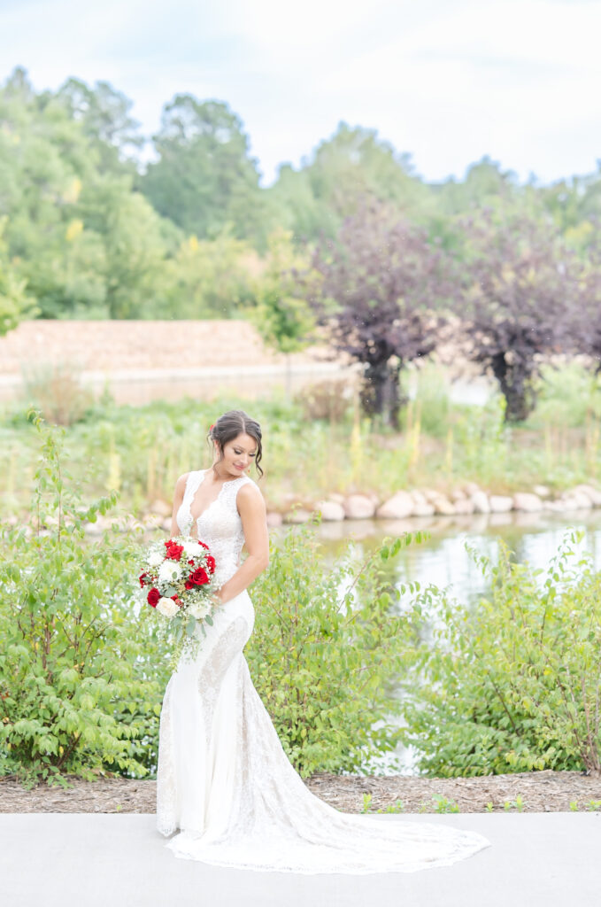 Portrait of the bride with her bridal floral bouquet at The Pinery At The Hill
