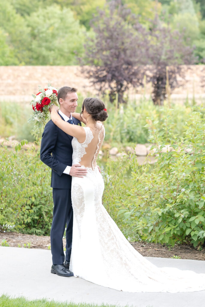 Bride and groom first look at The Pinery at The Hill wedding venue in Colorado