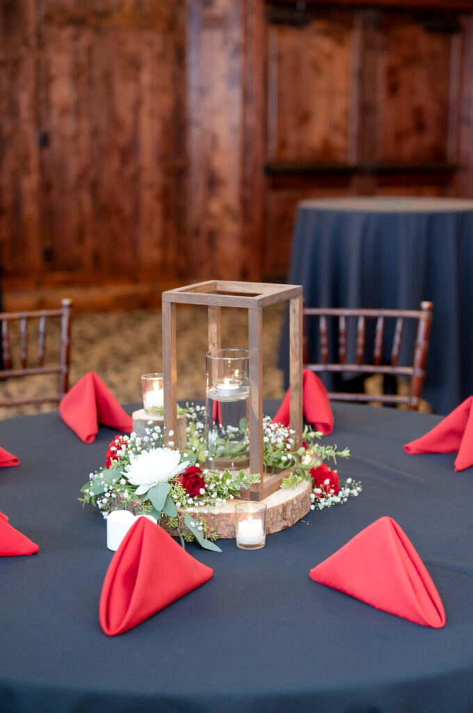 Romantic candlelit reception tables at The Pinery At The Hill wedding venue