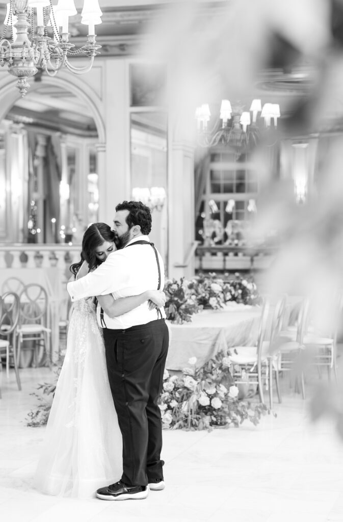 Bride and groom sharing their last private dance, in the reception ballroom, at The Broadmoor 
