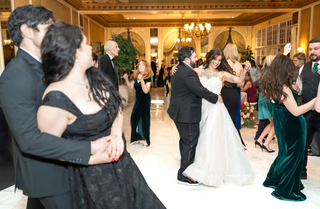 Bride and groom dancing with their wedding guests, at their winter wedding reception, at The Broadmoor in Colorado Springs