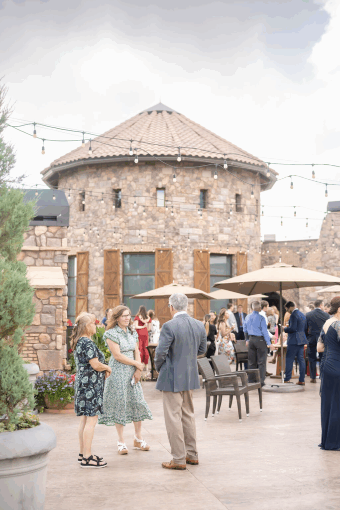 candid cocktail hour photograph at flying horse resort, a colorado springs outdoor wedding venue