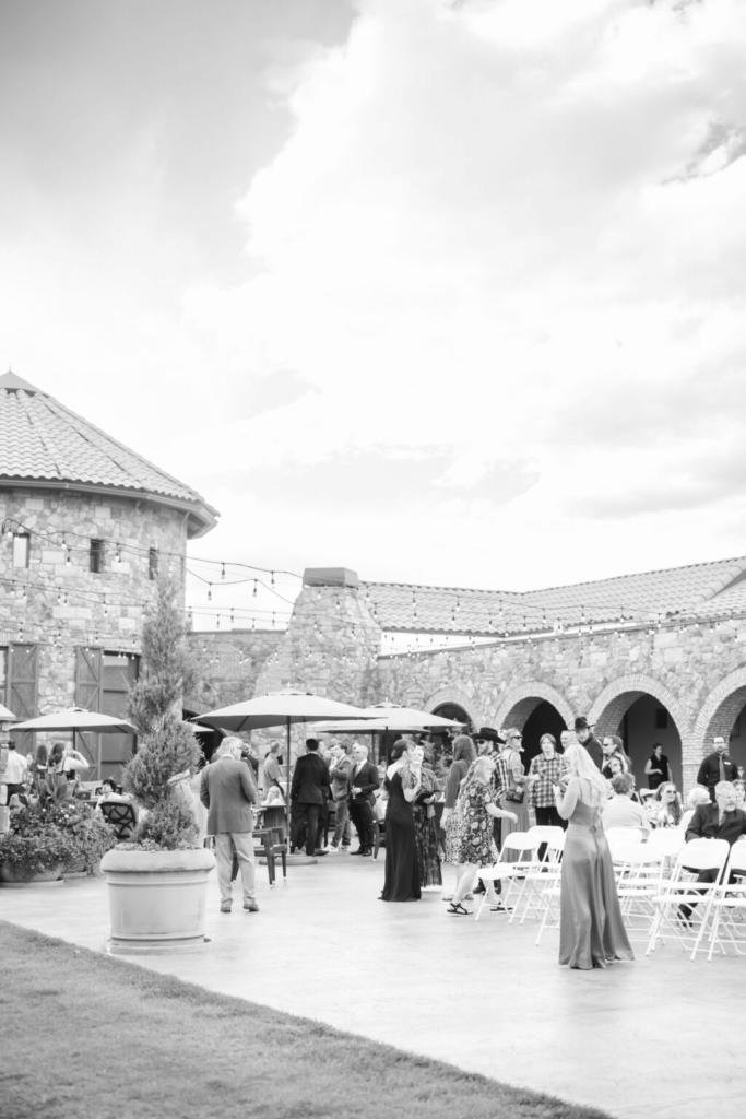 candid photo of a cocktail hour during a colorado springs outdoor wedding at flying horse resort