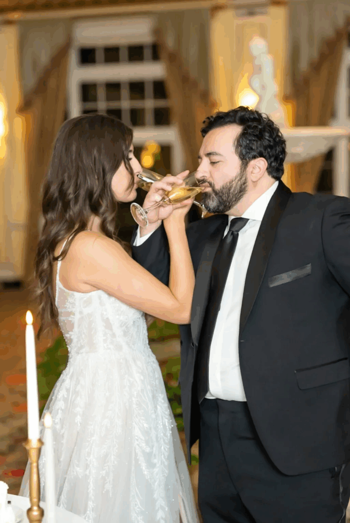 bride and groom drinking champagne at the broadmoor, colorado springs, during their wedding