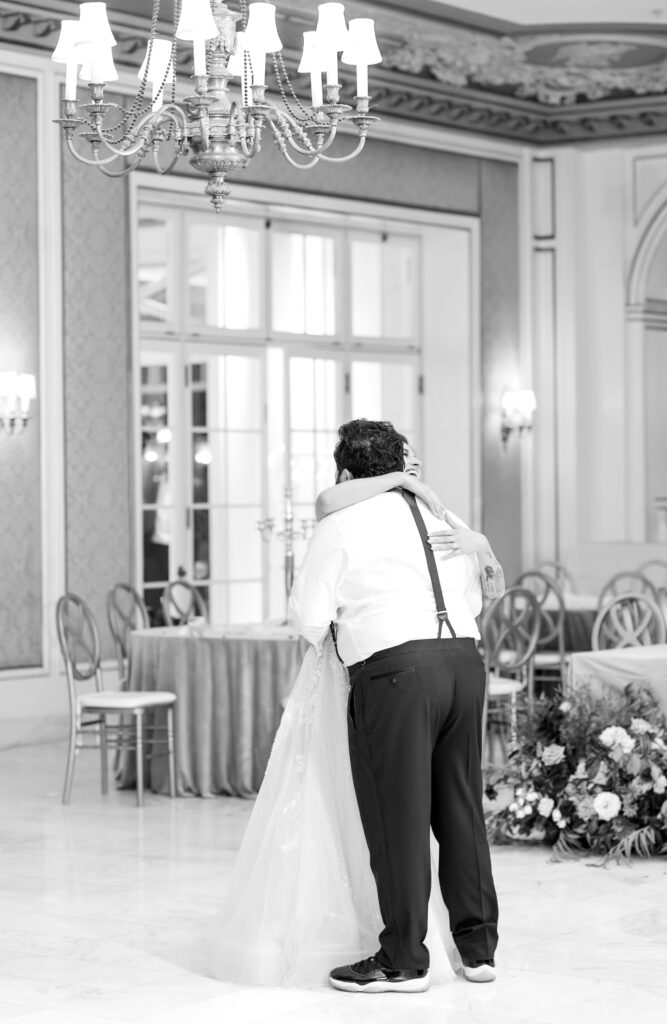 Bride and groom sharing their last private dance, in the reception ballroom, at The Broadmoor wedding venue in Colorado Springs