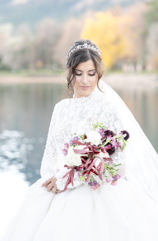 Detail portrait of the Bride looking down at her bridal bouquet on her winter Colorado Springs wedding day at The Broadmoor