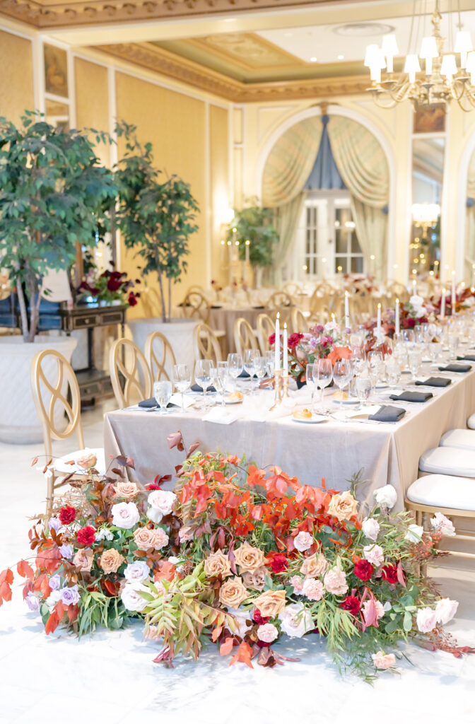 Detail photo of the winter florals against the dining table in the reception hall, on Colorado springs wedding day, at The Broadmoor