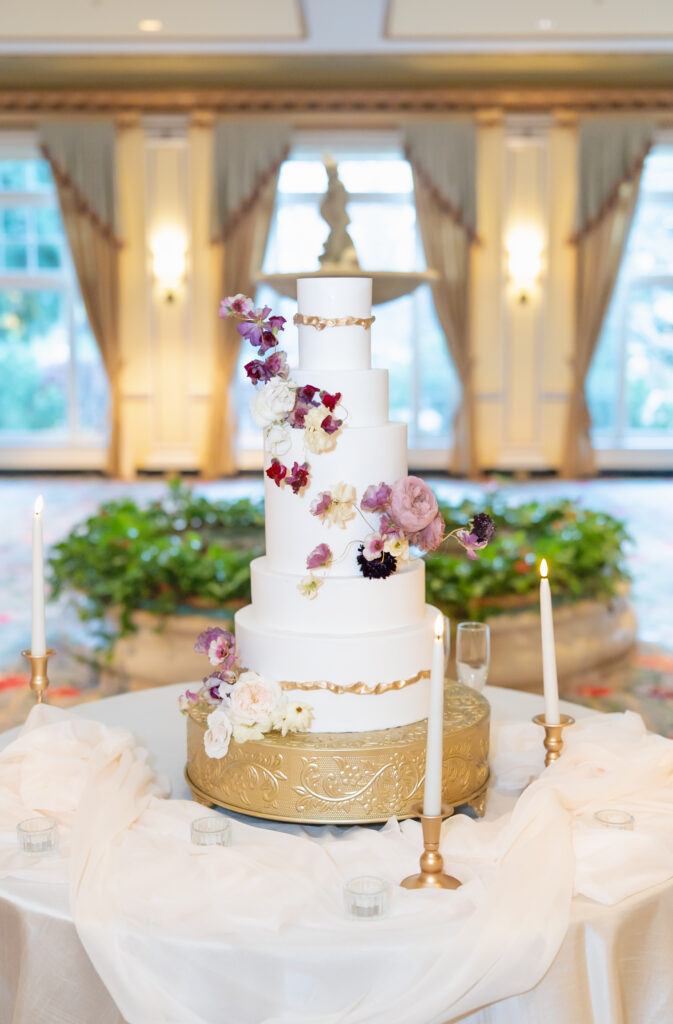 Detail photo of wedding cake, in the reception dining hall, at The Broadmoor wedding venue
